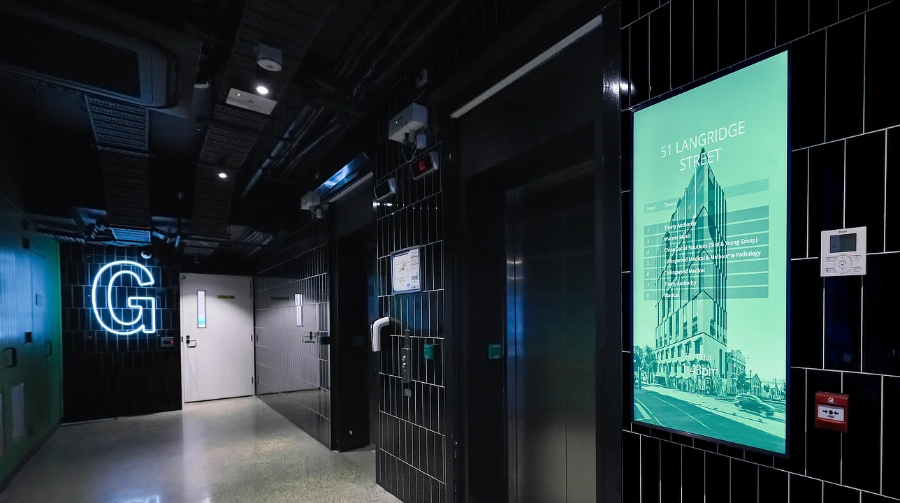 Sprocket GO digital tenant directory installed in a cool moody foyer at 51 Langridge St in Melbourne Australia
