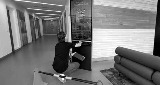 Technicians installing Sprocket GO digital directory